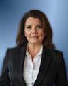 A person in a black suit  AI-generated content may be incorrect.
